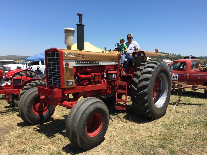 1970 I.H.1456 Demonstrator -     Introducing a future young collector to older classic I.H.at the Santa Margarita Ranch Show in Ca. Enjoy giving first rides to children whose eyes grow so big getting on these monster tractors to them.