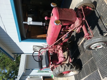 1953 Farmall Cub - This is my 1953 Farmall Cub Tractor. I purchased it about 16 years ago, and in 2002 started restoration process. During this time, I got married and also became a father. This tractor was reassembled and placed in storage for the past 15 years, half restored. This past month I have pulled the tractor out of storage, got it running again, and have been using it around my place. Other then needing rings or valves, the Hydraulic unit after rebuild is not working. so, with those two repairs in mind, I may go ahead and finish the restoration in the near future. For more information, please contact me at rebthetractorman@gmail.com