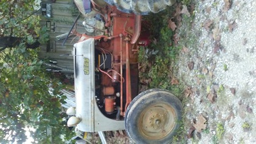 1952 8N Ford Tractor  - With front loader and bucket. Runs  great, doesn't smoke or leak. Has new  tires with fluid and new carburetor.