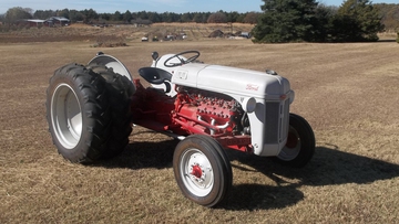 1950 8N With 1950 Flathead V8 - 1950 8N ford tractor with 1950 truck flathead V8 110 horse  has all new tires, dual rear tires, has flip up hood to get to the engine. has blinking red lights on rear with new head lights. great for show or could be a winner in its class in tractor pulls.