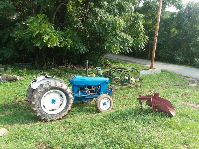 1974 Ford 3000  - got the tractor it was factory state road yellow. Me  and the wife painted it ford blue and white