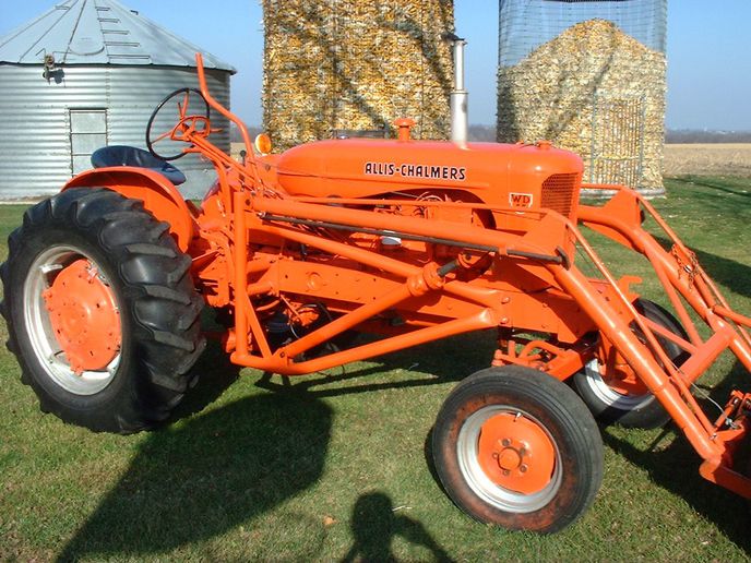 1954 Allis Chalmers WD45 - Great tractor with trip snow bucket. Moves lots of snow with added  chains   fluid in rears. Was converted to 12 volts before I bought it.