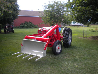 1961 Ford 861 Powermaster   -  I purchased this tractor with the deerborn loader from a friend and took my time restoring it. It is the 2nd. Ford that I have restored. The red and grey combination makes these tractors really stand out beautifully.