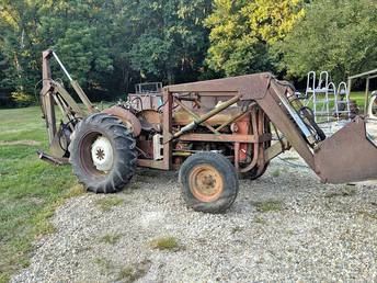 1960 611 - My son and I purchased this for 1500. I believe the  tractor is a 611 with Select-O-Speed, no 3 point but  does have a PTO driven pump. It has a Ford front  loader and Sherman Power Digger. I also modified so  that the front loader shares the backhoe pump.