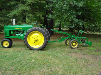 1947 John Deere Model A - My first restoration of a 'real' tractor-- had done a  few JD garden tractors.  I got it in pieces and am  now well acquainted with rust, angle grinders, wire  brushes, rust, lye gravy, rust, electrolysis, rust  phosporic acid, rust primer and paint.   Before that inside the engine-- sludge, bearings,  pistons, machine shops, carb passageways secret or  known,  sparks, sludge and as always SURPRISES.