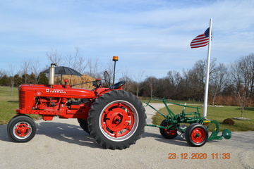 1952 Farmall H - My dad bought this tractor new in Elizabethtown,KY. I was 3years old then. We farmed with it till 1977. Been in my family since 1979. Overhauled in 1967 (year I graduated H.S.) and had the head redone this past year. Used for hayrides-parades and tractor runs with my tractor buddies. Last painted around 2000.  The H spent a lot of time pulling a haybaler (T50