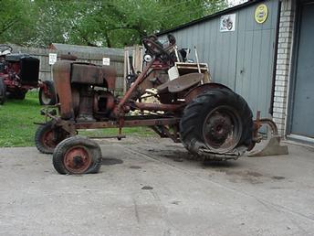 194? Country Squire (Sinking) - Found this tractor in Inkster MI. Sinking into the ground for the last 35 years or so. Struck up a deal with the older gentleman, Also have all the implements that came with it, turning plow, disc, cultavators, spike drag, .He bought it brand new.I now have it running and everything broke free, awaiting tires to go for a ride!