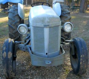 1953 Ferguson TO30 - Headlight Trouble - Cross-eyed TO-30.  Was Grandads new tractor in 1953.  I'm gonna put her back to work around the yard.  How do I keep the headlights both ponted in the same direction?  Something is missing inside the bucket I suppose.