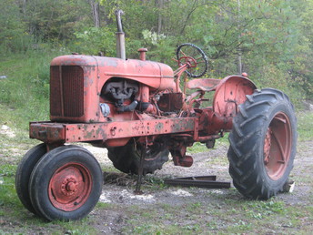 Allis Chalmers WD Finally In From The Field - I just drug this out of our farm yard where it has been for years and before that it was in a field next to my Grandma's house since I can remember.  It's serial # 1011 so I'ld guess that would be a first year made? I got the engine to turn but not one of the wheels, the rearend is right full of mice.Now I need to learn about mags and see wht damage the mice have done.  Thought you'ld like to know this one's not going to the scrapper