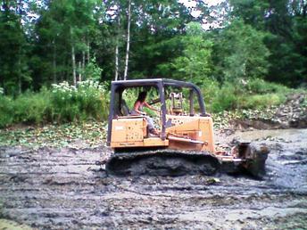 2001 650 Case - this is not a great picture but my accountant wanted to push some mud...she jumped on in her dress...never ran a dozer before and pushed mud. I promised myself I would marry this girl someday and did!!!