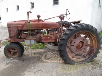 Chain Drive Farmall - Looks like it had some help getting this far. Swiss Cheese rust all over this old guy.