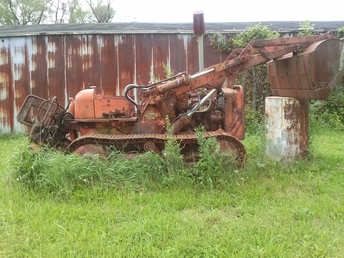 Allis Crawler - Left outside all winter, hasn't moved lately. Scrap iron piled on top of the ripper.