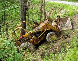 John Deere Backhoe - oops, guy down the road trying to do too much, with too little.