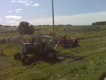 Oliver 1755 Stuck In The Ditch - Stopped along the Highway to snap a picture of this poor 1755 Ollie that was just trying to get the mowing done.