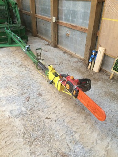 Tractor pole outlet saw