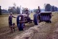 1947 Farmall H Pulling A New Holland Model 76 Baler - This was scanned from a color slide...My grandmother is driving the H,thats my grandpa with Amos the farm dog...I would estimate this was taken late 50