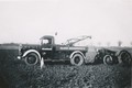 Fordson Getting Unstuck - My uncles tractor and field in the thirties.  Dog sees to it, that the wrecker driver stays in his cab