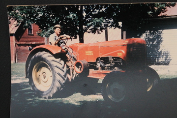 Massey Harris 201 - My great uncle Victor Schneider with a color photo of his 201 taken in the 1950's