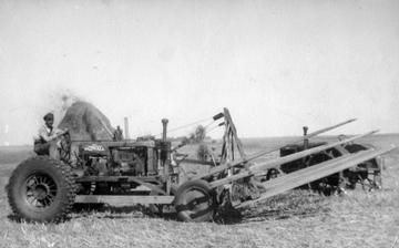 1929 Farmall Picking Up Bundles - This is my uncle, not sure what year, had  to be in the 1930s, I don't know if they  made this or what, it was made to pick  up bundles