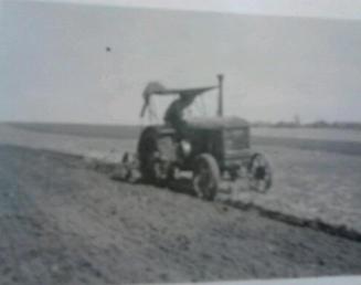 Mccormick Deering 1020 - These are my two uncle's, looks like  some type of buggy top,used for shade  and rain