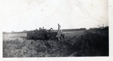 Dont Know - Could really use some help identifying the old picker.  Was taken in the late 40's south of Sigourney Iowa along Highway 149.