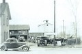 Old Cars & Tractor 1942 - Photo was taken in April 1942. Can you tell me what the Cars & Tractor are ?