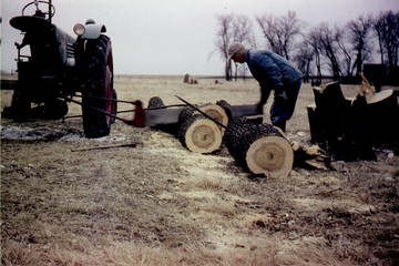 1951 Oliver 77 Row Crop W/ Pto Saw Blade - Grandpa Nels operating the old 77 with a  home made pto/pitman saw attachment.   Cutting up cottonwoods to heat the  farmhouse down in Iowa.  I've seen video  of this thing in action.  It worked  great!  Photo taken Dec. 1957