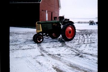 1951 Oliver 77 Row Crop - The 77 after a fresh paint job and new  style padded seat with backrest.  Photo  taken Jan. 1969.