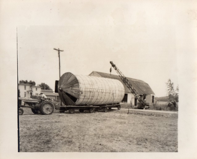 Moving A Silo #2 - These are 6 pictures from 1962 when my Uncle Jerry Orbaker had a wooden stave silo moved from his farm across the road to my Grandpa's farm.That's my Uncle's John Deere 520 tractor