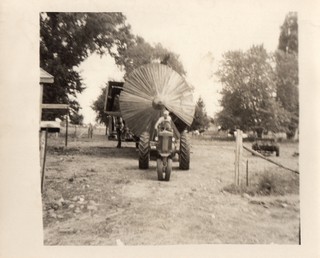 Moving A Silo #3 - These are 6 pictures from 1962 when my Uncle Jerry Orbaker had a wooden stave silo moved from his farm across the road to my Grandpa's farm.That's my Uncle's John Deere 520 tractor