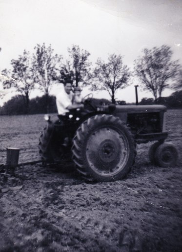 1950 Oliver 66 - My Dad and I planting corn. Blackhawk planter  converted from horse drawn. Back of photo says I  was 2, so picture from 1959.