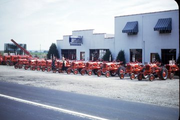 Farmall Dealer - This is a photo of my uncle's Farmall dealership taken in late 1947.  Two of my aunts are shown in the line up of newly introduced Cubs.