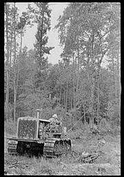 Clearing Land - Crawler Tractor being used to clear land in North Carolina.  Picture taken 1935, from Library of Congress, Prints