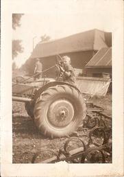 1940  John Deere L - This is first day i drove the L,I was 7years old. I remember starting it with the crank by jumping off the front wheel onto the crank, and i'm still alive!
