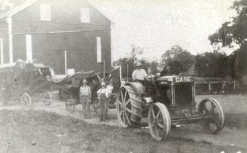 1917 Case 22-40 With Baler And Thresher - Photo is dated 1928. Dad was 10 years old, I assume he was the kid on the tractor with Granddad.