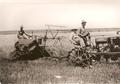 1932--36 F-20 Farmall And Thresher - This photo is of my grandad; seating on tractor seat; my father, on thresher and my dad
