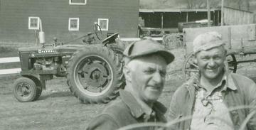 Farmall H  - My Dad's (Andrew) first tractor, photo from early 1950's at Kimballton, Iowa. Traded in on a new AC WD-45 in 1953. Our neighbor farmer, Ralph Mathiesen (background), is comng in for coffee.