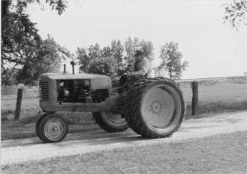 1945 Massey Harris 101 Junior - My Dad, Dick Frahm, on his 1945 Massey Harris 101 Junior. He and Grandpa bought it new in 1945. My Mom still has the tractor.
