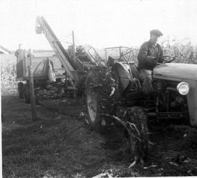 1955 Ferguson TO-35, Wood Bros. Picker - My grandfather, 1955 TO-35, Wood Bros. corn picker, and Ferguson WJO 22 Wagon. Taken fall 1958 in Odebolt, IA. My sister and I are in the wagon. We still have the tractor and the wagon.