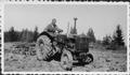 1937 Case D Or  Rex ? - This picture shows my father after he bought his first tractor in 1937. I am not sure of the name of the model. Could 