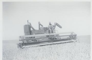 Massey Harris 90 Special Combine - Grandpa cutting wheat with a MH 90. Picture was taken in 1956 so the combine has to be fairly new. I still have the parts and Operators manual which is good because last year I bought a field ready MH 90 for 300 to bring back the old times. The MH 90 was our 3rd self propelled combine. Before we had a MH Super 27 and before that a 21A in the picture farther down this page.