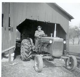 Allis Chalmers 1957 D 14  - This is my Father on his 1957 D 14 that he bought new. I still have this same tractor today. Has been in the family since it was new.