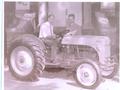 New 8N Ford   At Pataskala Centenial 1951 - This was taken in front of the town hall on Main St. during the 100th aniversery of the founding of Pataskala in 1951.  Levi Streets, the Mayor is on the seat and Nelson Palmer owner of Palmer Tractor Sales Etna Ohio is standing behind the tractor.   Levi was my wife
