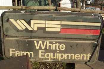 White Farm Equipment Sign
