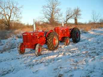  **Pair Of New Red Tractors**