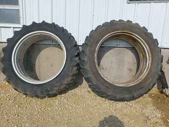 15.5X38 Tires And Rims - Selling a good pair of 14x38 double bevel  rims with mismatched 15.5x38 tires. One ~nl~tire is a firestone that is pretty weather ~nl~checked, the other is a long bar short bar ~nl~coop tire in good shape. Both are at least ~nl~60 percent tread. Please call with ~nl~questions.